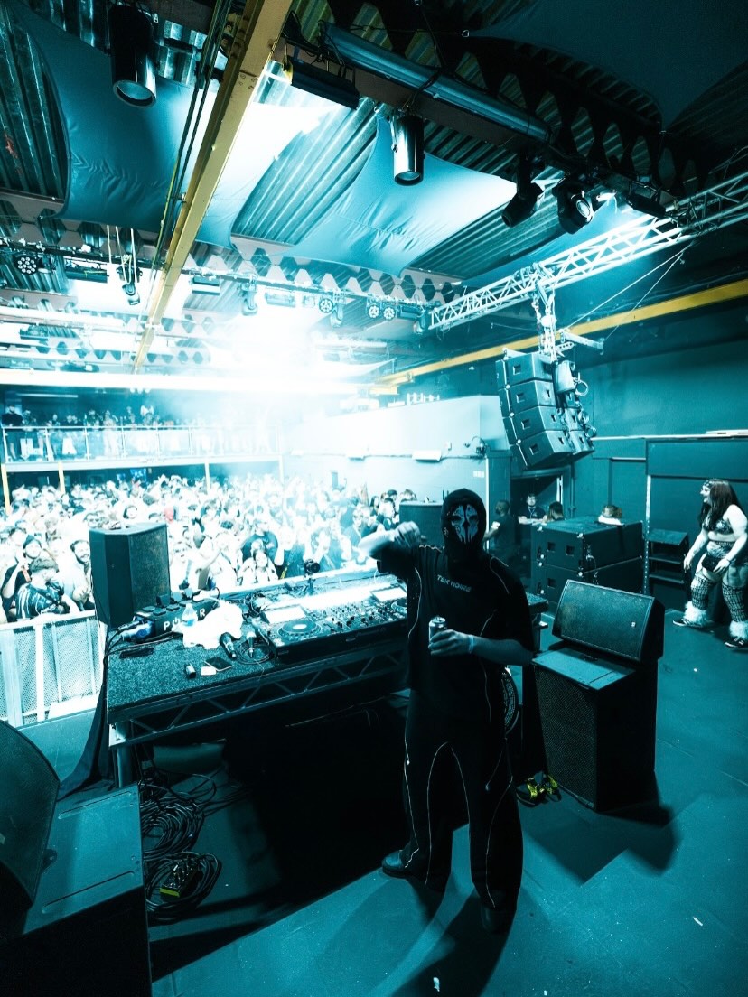 On stage at Hangar 34 — DVOID × EXHILARATION closing set